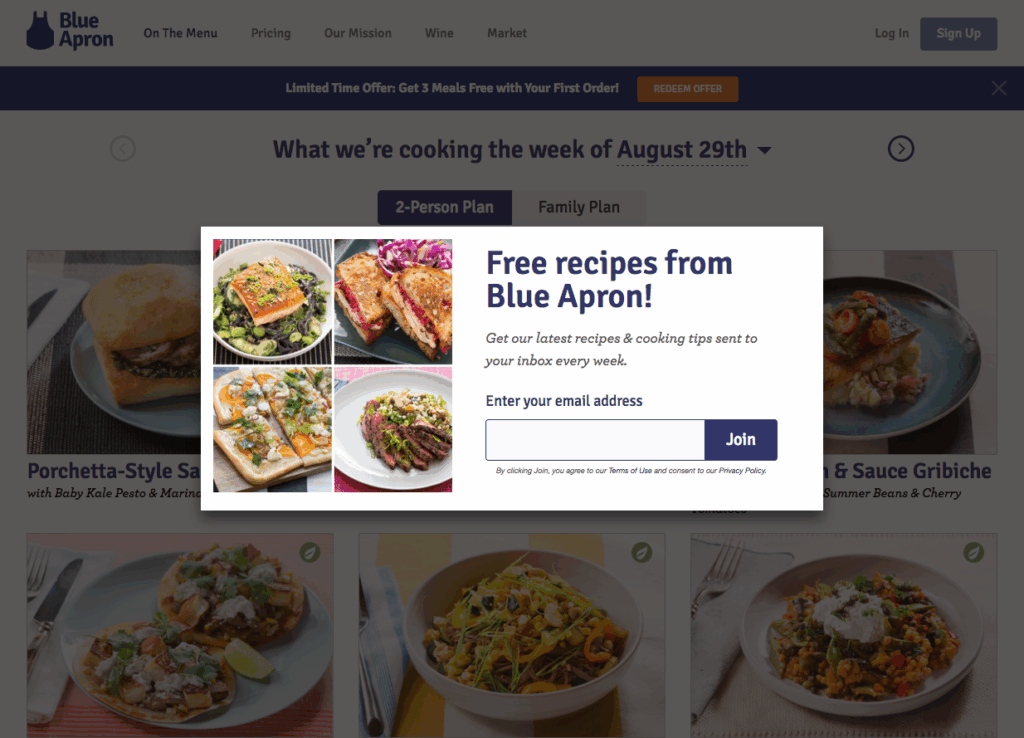 Blue Apron recipe email signup popup offering free weekly cooking tips and recipes, displayed over meal plan content.